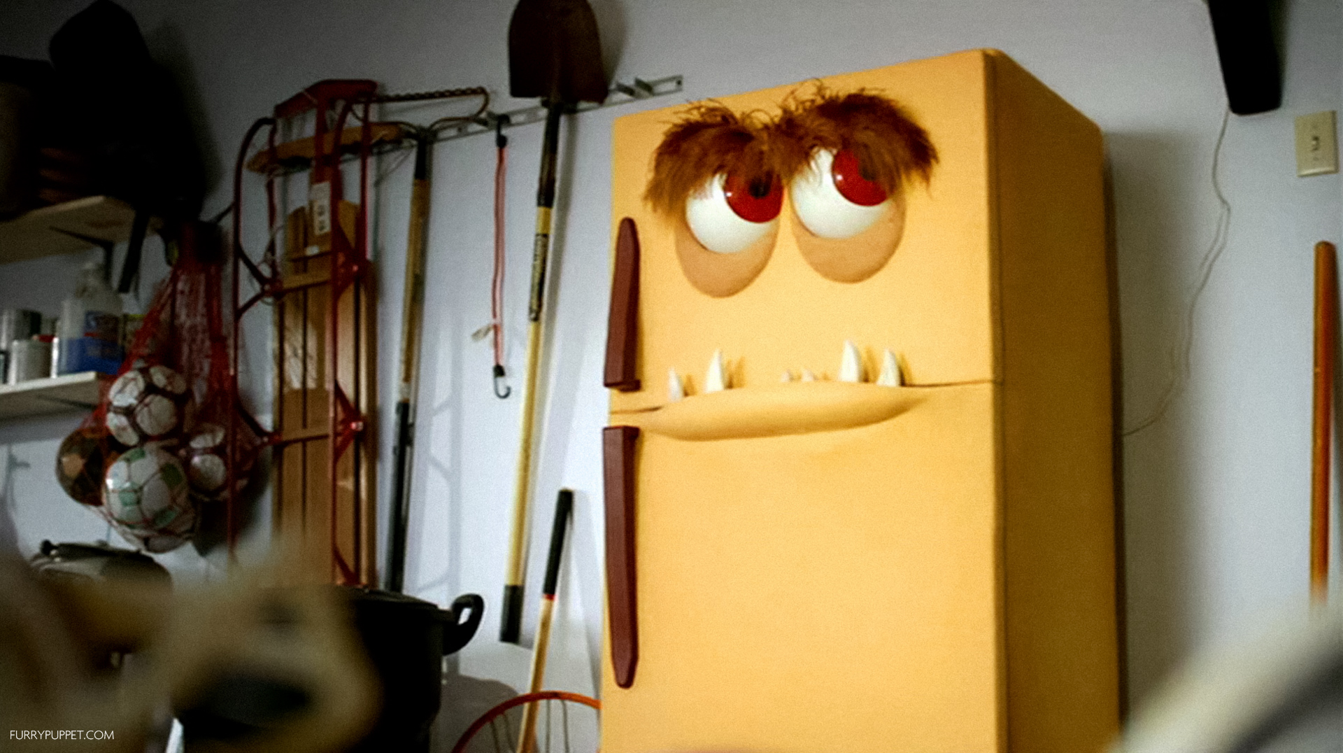 Talking refrigerator character puppet with googly eyes built by Furry Puppet Studio
